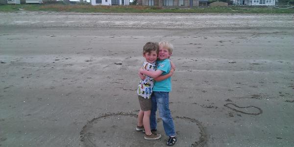 Boys playing on the private beach at Sandgreen